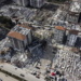epa10452945 A photo taken with a drone shows a an aerial view over collapsed buildings after an earthquake in Hatay, Turkey, 07 February 2023. Thousands of people died and thousands more were injured after major earthquakes struck southern Turkey and northern Syria on 06 February. Authorities fear the death toll will keep climbing as rescuers look for survivors across the region.  EPA/ERDEM SAHIN