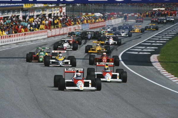 Imola, Italy
21-23 April 1989
Alain Prost leads Ayrton Senna (both McLaren MP4/5 Honda) and Riccardo Patrese (Williams FW12C Renault), Nigel Mansell (Ferrari 640) and Alessandro Nannini (Benetton B188 Ford) at the start
Ref: 89 SM 06
World Copyright - LAT Photographic