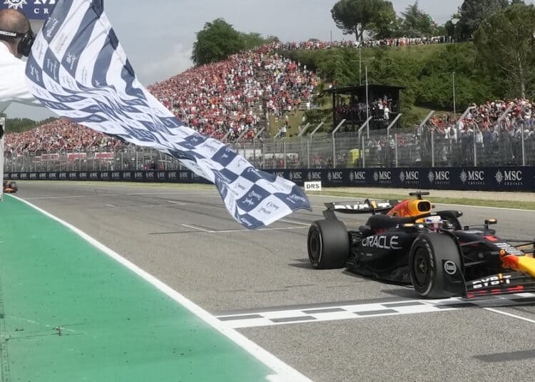 Red Bull driver Max Verstappen of the Netherlands crosses the finish line to win the Italy's Emilia Romagna Formula One Grand Prix race at the Dino and Enzo Ferrari racetrack in Imola, Italy, Sunday, May 19, 2024. (AP Photo/Luca Bruno, Pool)